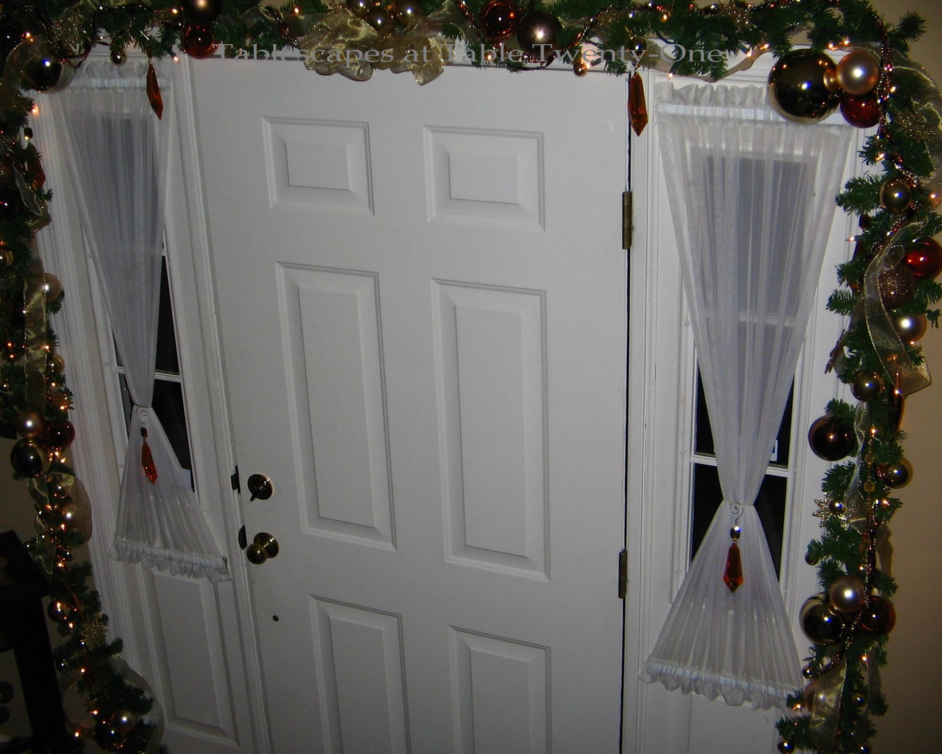 Garland around front doorWM