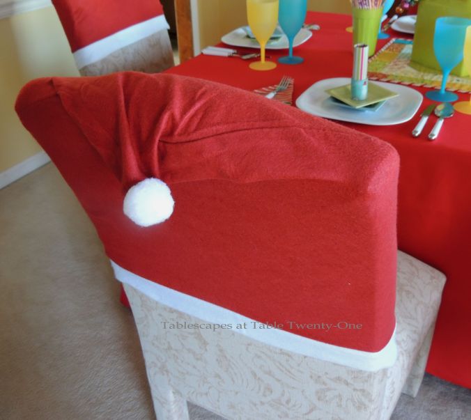 Tablescapes at Table Twenty-One, Kaleidoscope Christmas - Multi-Color Kids' Tablescape: Santa hats from Dollar Tree on dining chairs