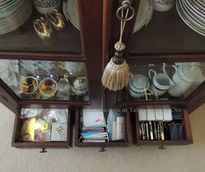 Tablescapes at Table Twenty-One, www.tabletwentyone.wordpress.com, “My Organized Mess – ‘Where Do You Keep It All?’” - drawers at bottom of dining room china hutch