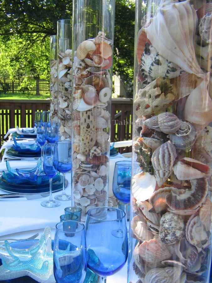 Tablescapes at Table Twenty-One, www.tabletwentyone.wordpress.com, Ocean Blue – Starfish & Seashells:  seashells in multiple tall glass cylinders