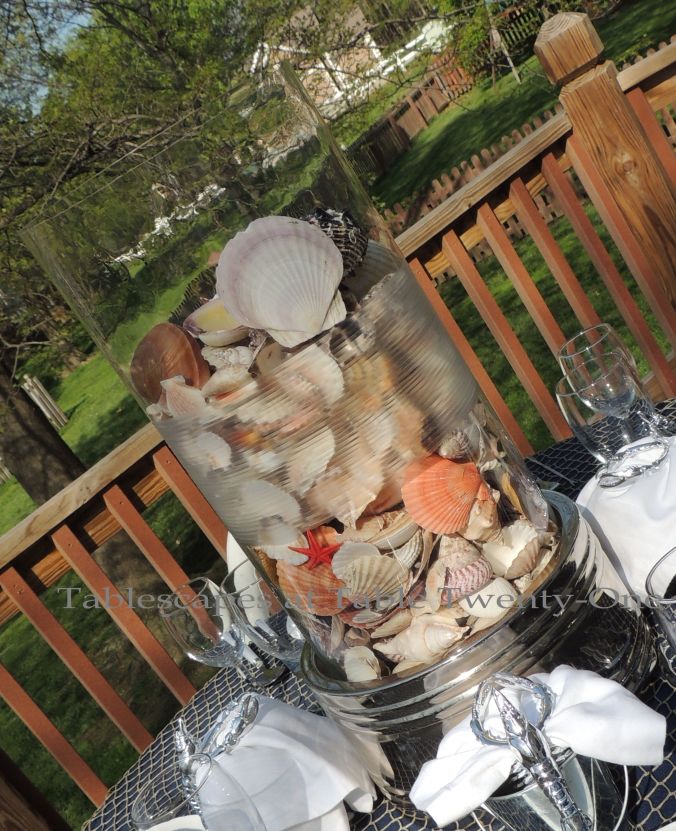 Tablescapes at Table Twenty-One, www.tabletwentyone.wordpress.com, Old Navy Seafood Boil - seashell centerpiece in raised glass cylinder