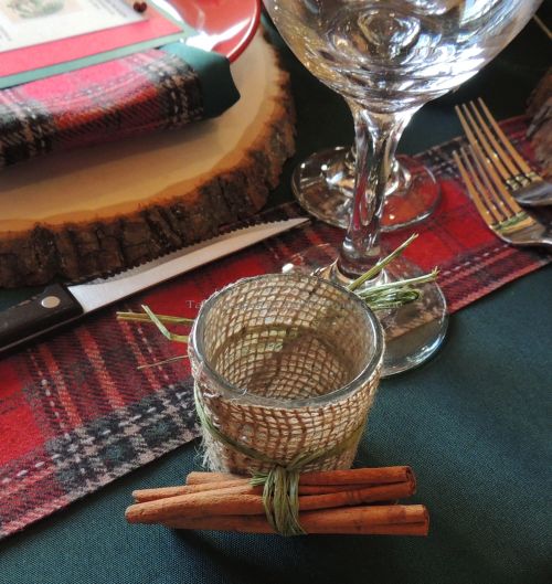 Alycia Nichols, Tablescapes at Table Twenty-One, www.tabletwentyone.wordpress.com, “Christmas in the Woods”: Burlap-wrapped votive tied with cinnamon sticks