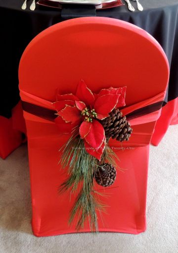 Alycia Nichols, Tablescapes at Table Twenty-One, www.tabletwentyone.wordpress.com, Cardinal Christmas: Banquet chair with red stretch cover, "cardinal", pine cone & poinsettia sash