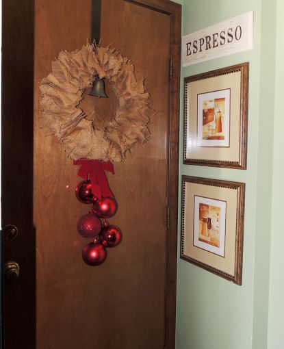 Alycia Nichols, Tablescapes at Table Twenty-One, www.tabletwentyone.wordpress.com, ”Timberland Christmas – 2014 Christmas Décor: Burlap wreath with red ribbon and ornaments on garage door