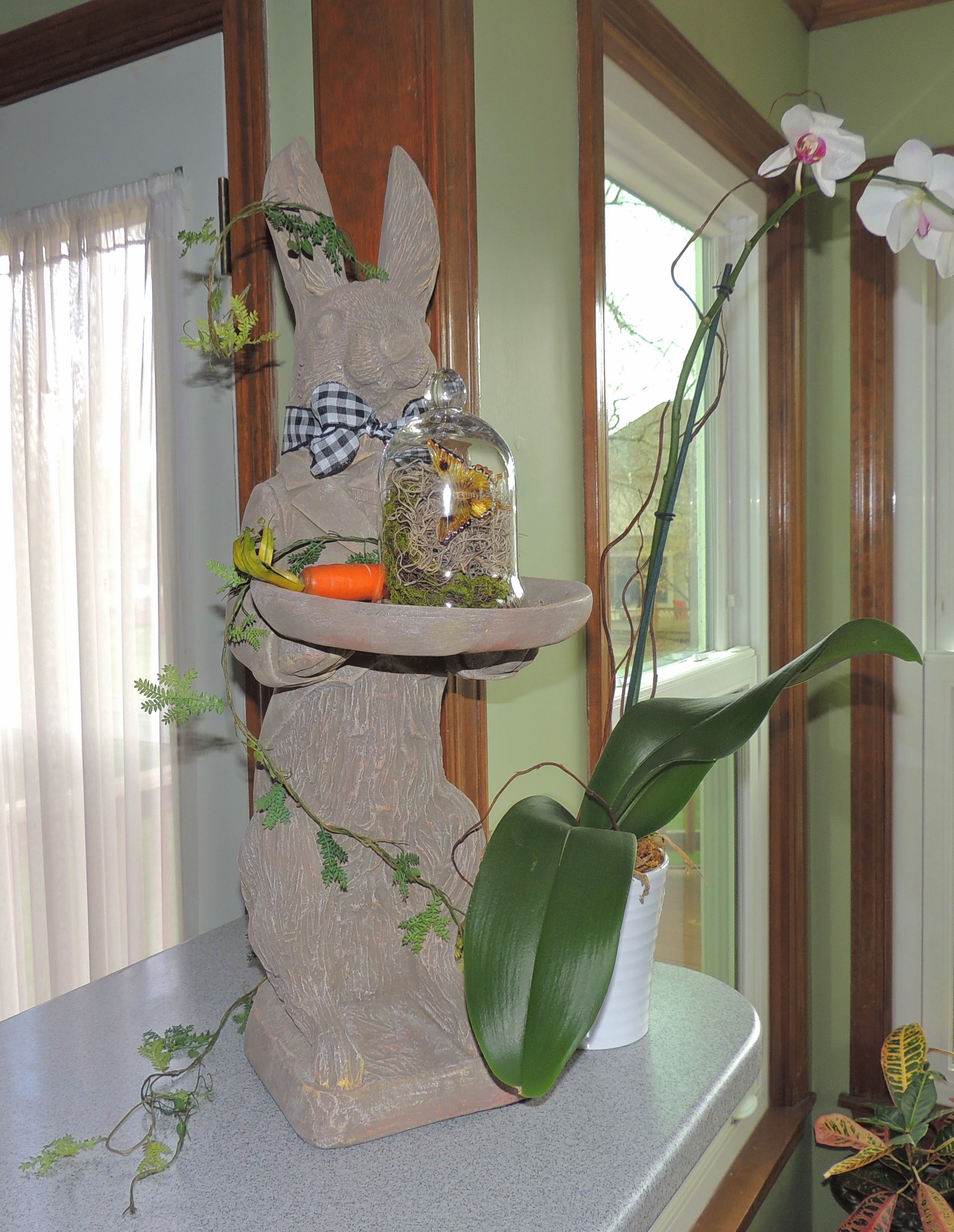 Stone bunny with glass cloche.